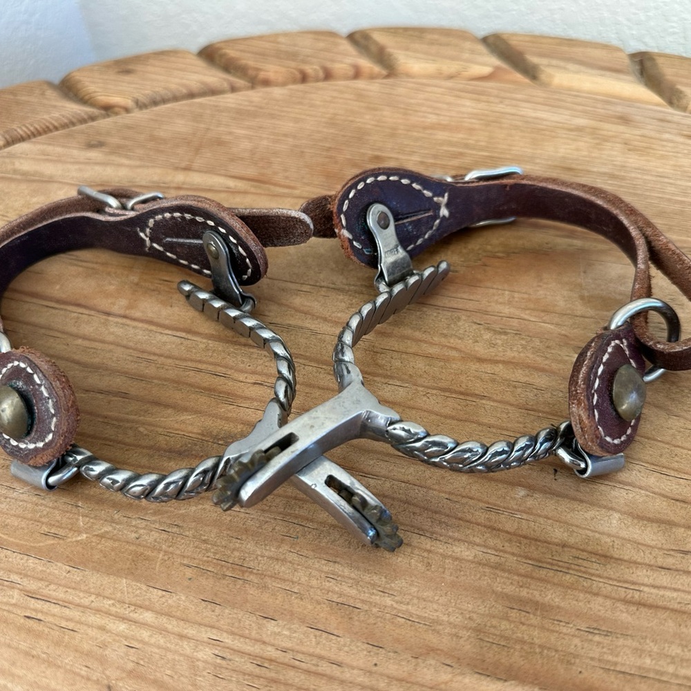 Spurs with brown leather straps